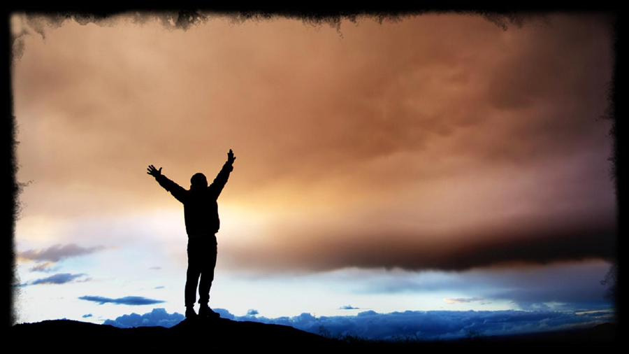 man-arms-uplifted